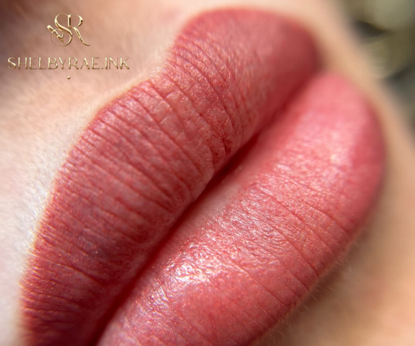Close-up of permanent makeup lip blushing with soft, natural pink tones enhancing lip shape and color, performed by Shelbyrae.ink in Rocklin, California.