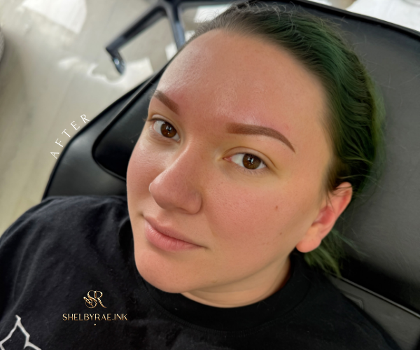 Healed permanent makeup brows with soft, natural pigment retention and even shape, photographed after the healing process.